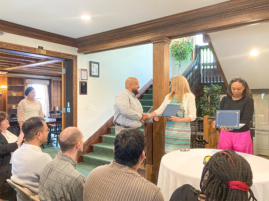 Graduate receiving his certificate at MCC's advanced manufacturing program graduation